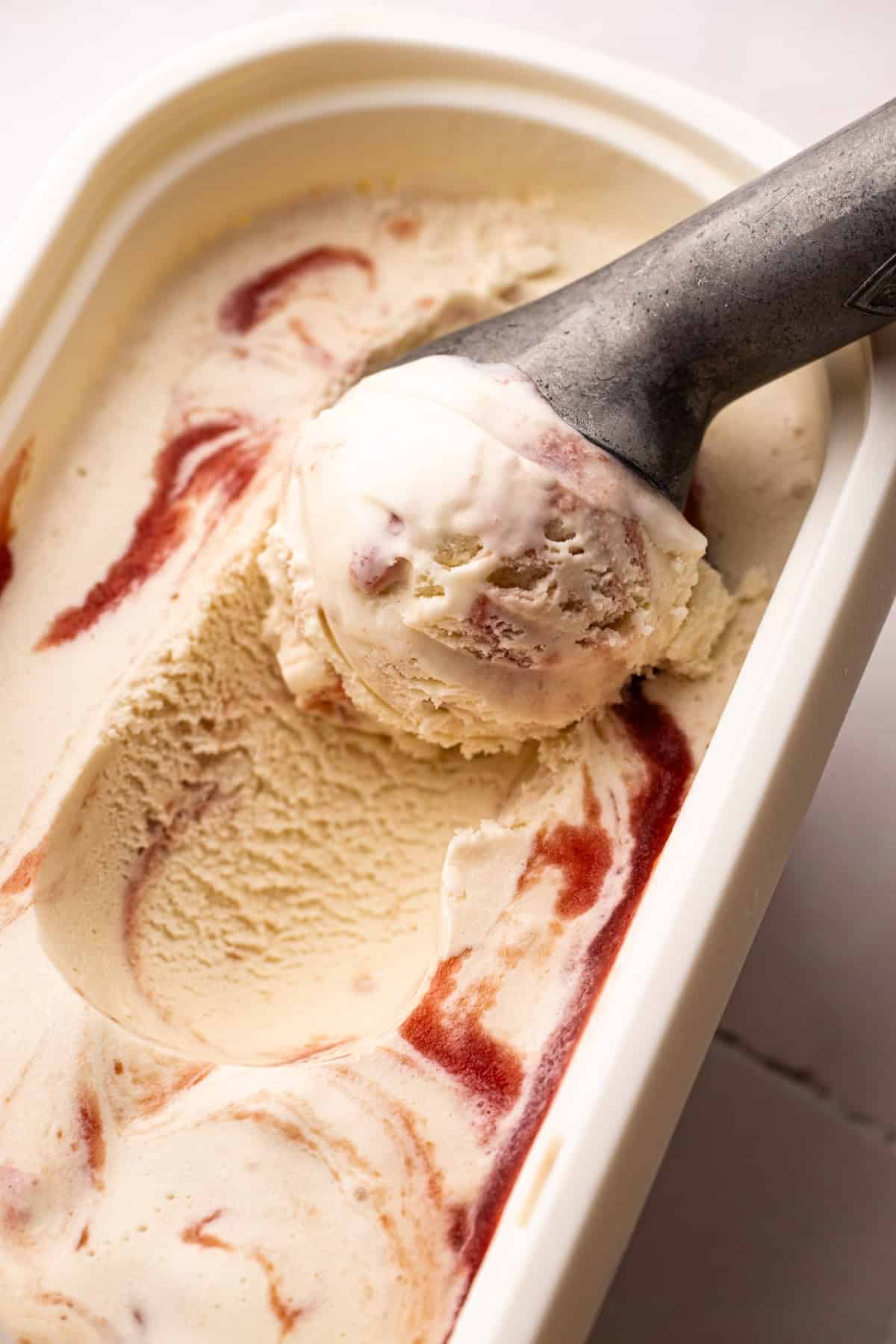 A scoop of rhubarb buttermilk ice cream.