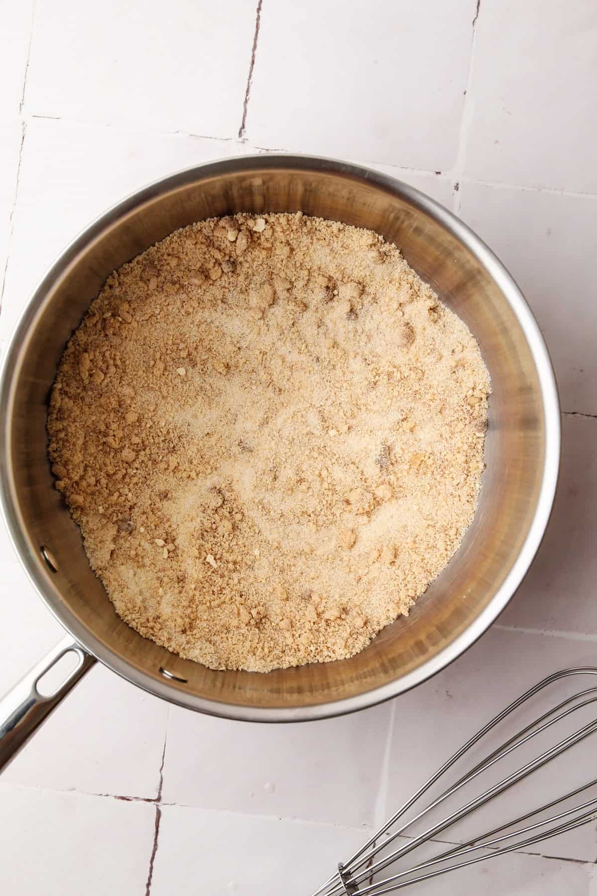 Whisking together the sugar and milk powder for grapenut ice cream.
