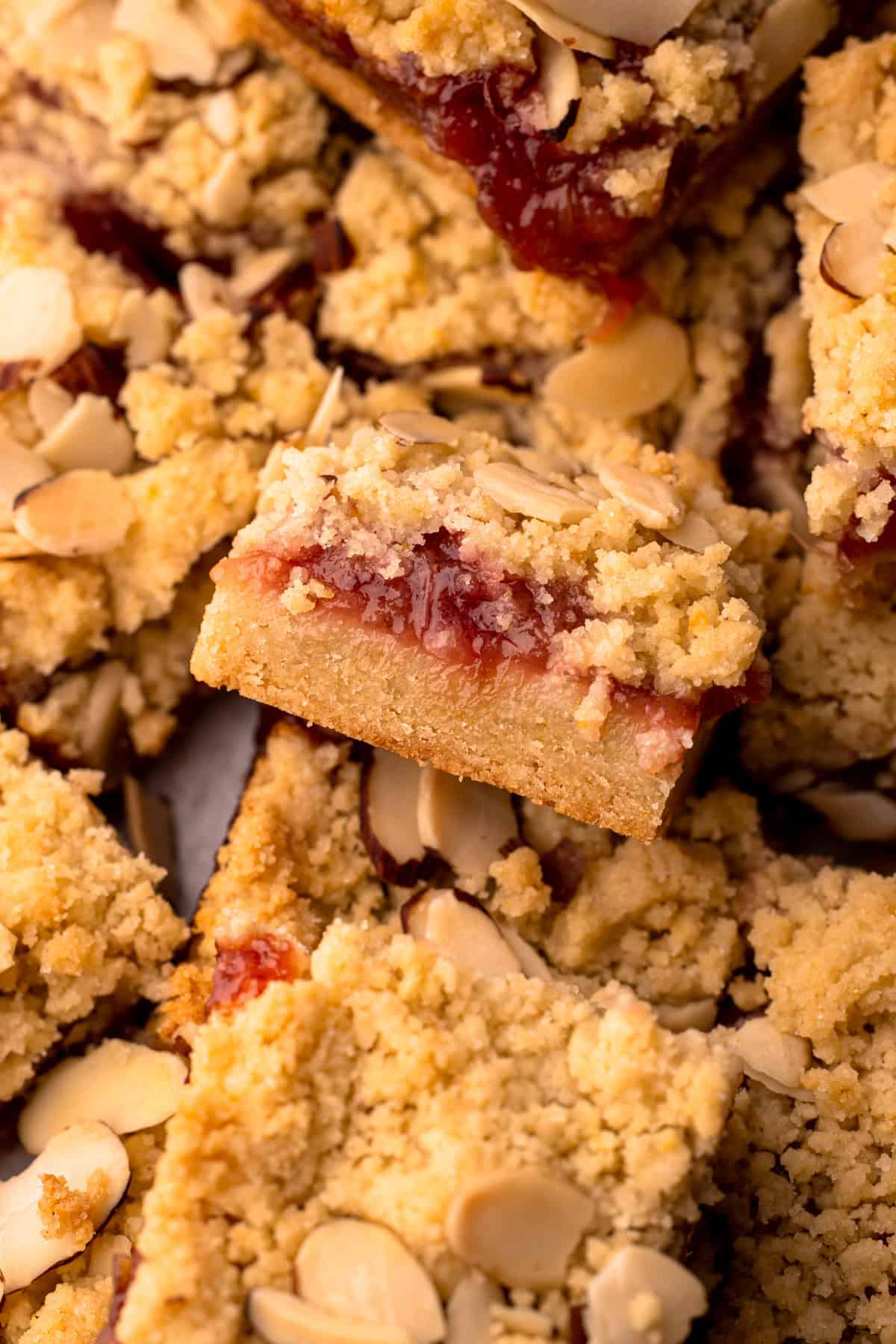 Baked rhubarb almond crumb bars in a baking dish.