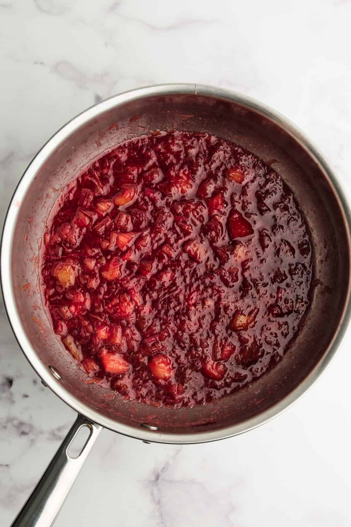 Cooked rhubarb in sugar to make rhubarb coulis.