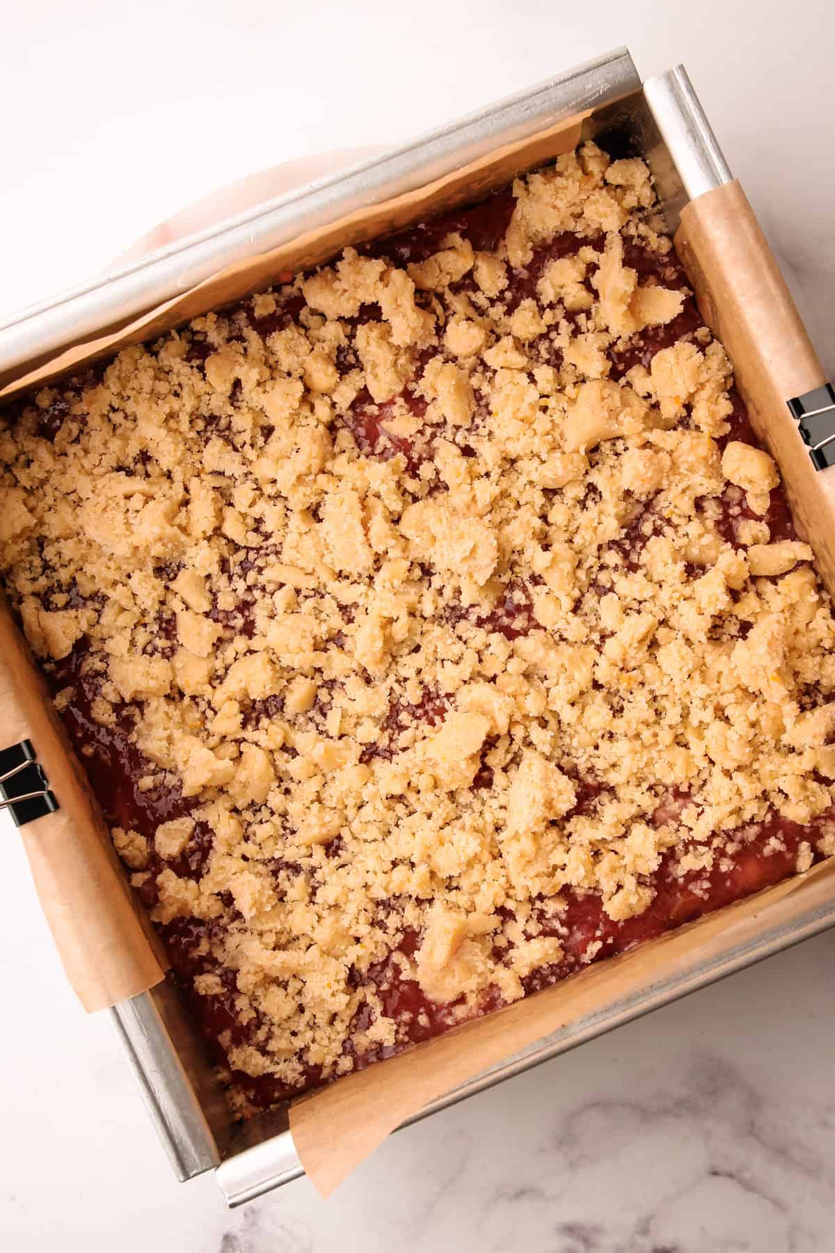 Unbaked rhubarb crumb bars.
