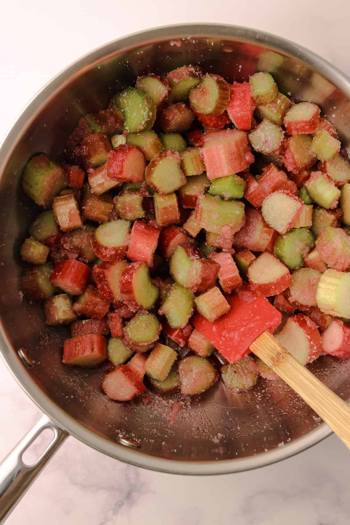 Cut rhubarb in a pot for rhubarb crumb bars.
