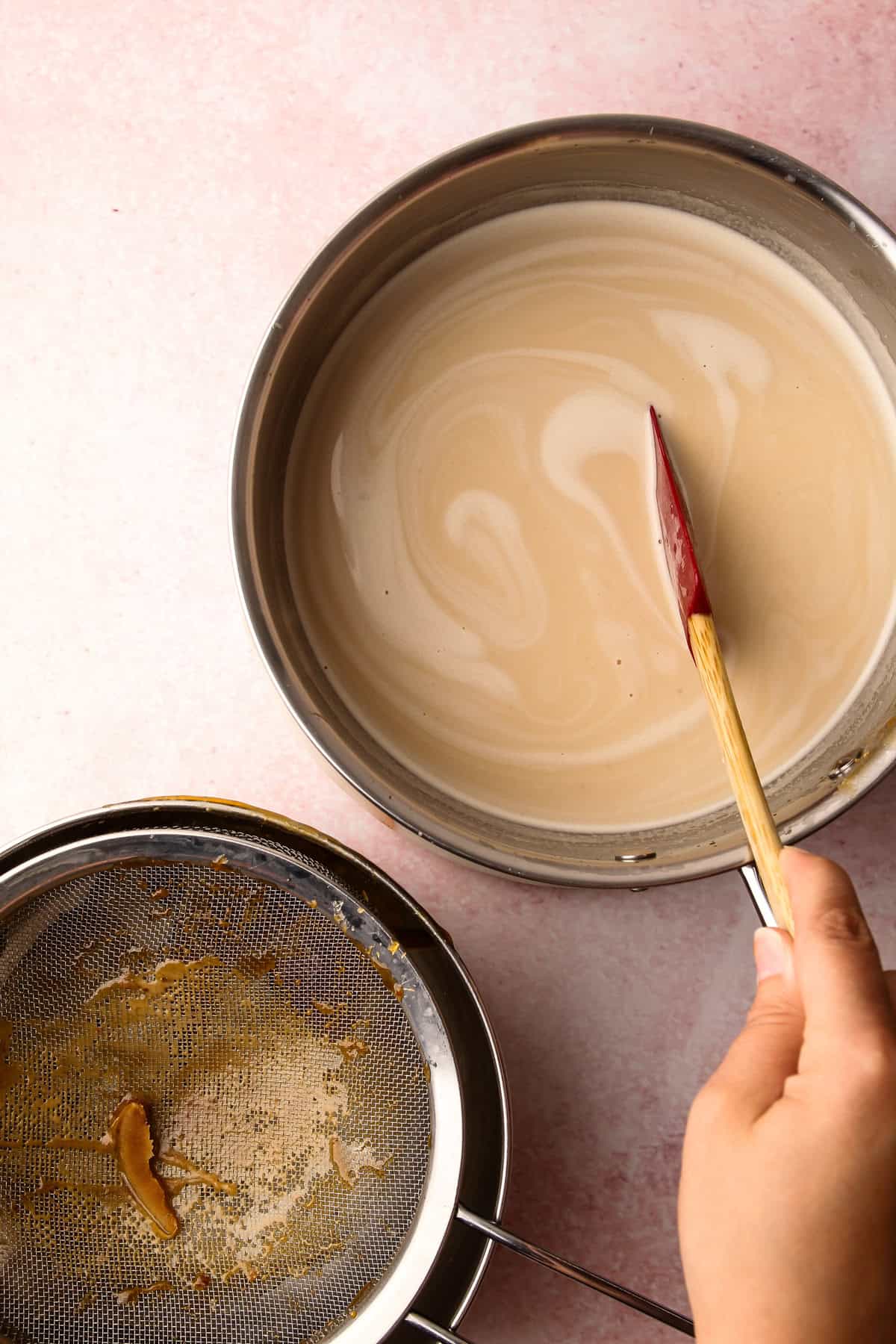 A pot of ingredients to make a maple custard for maple walnut ice cream.