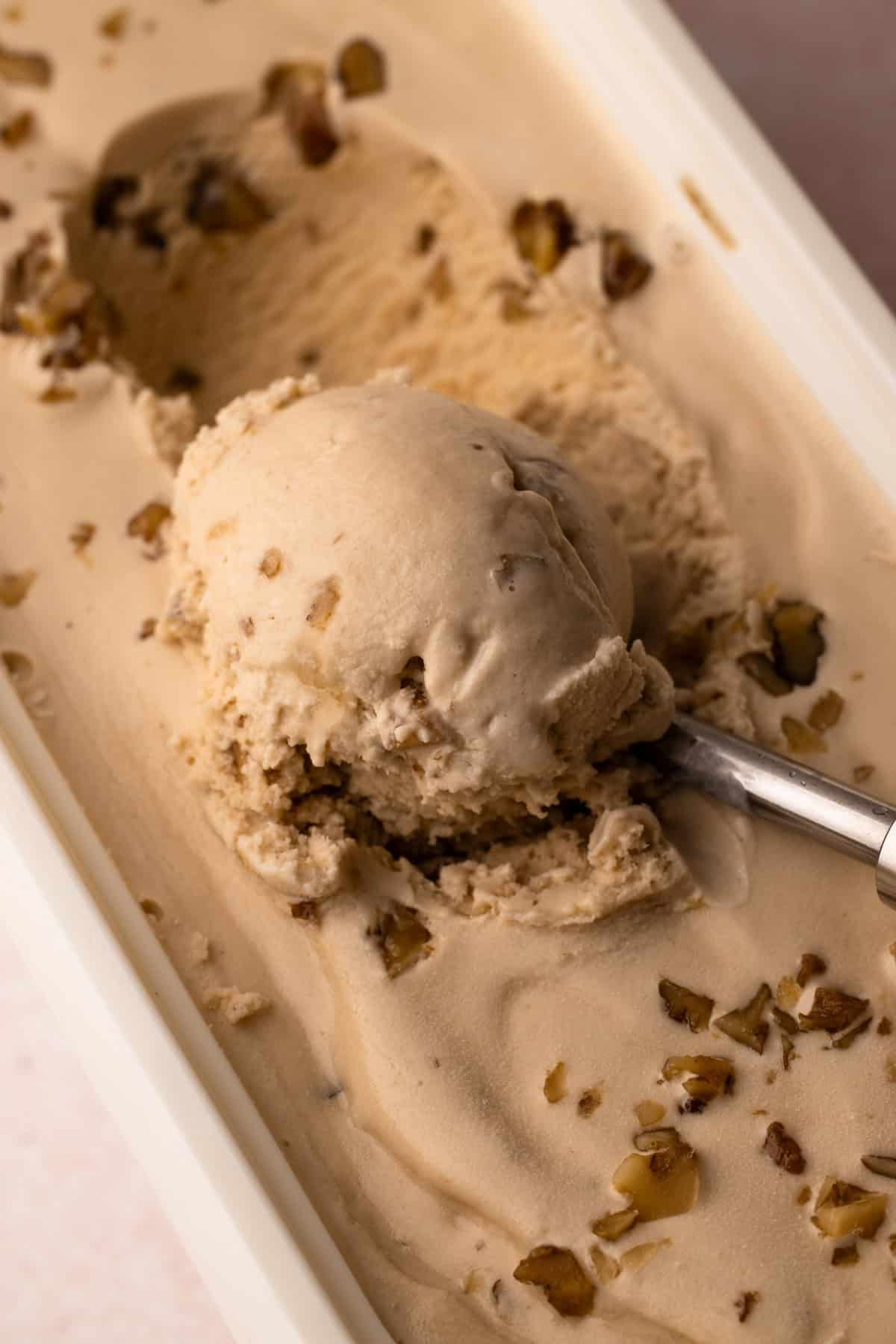 A scoop of homemade maple walnut ice cream.