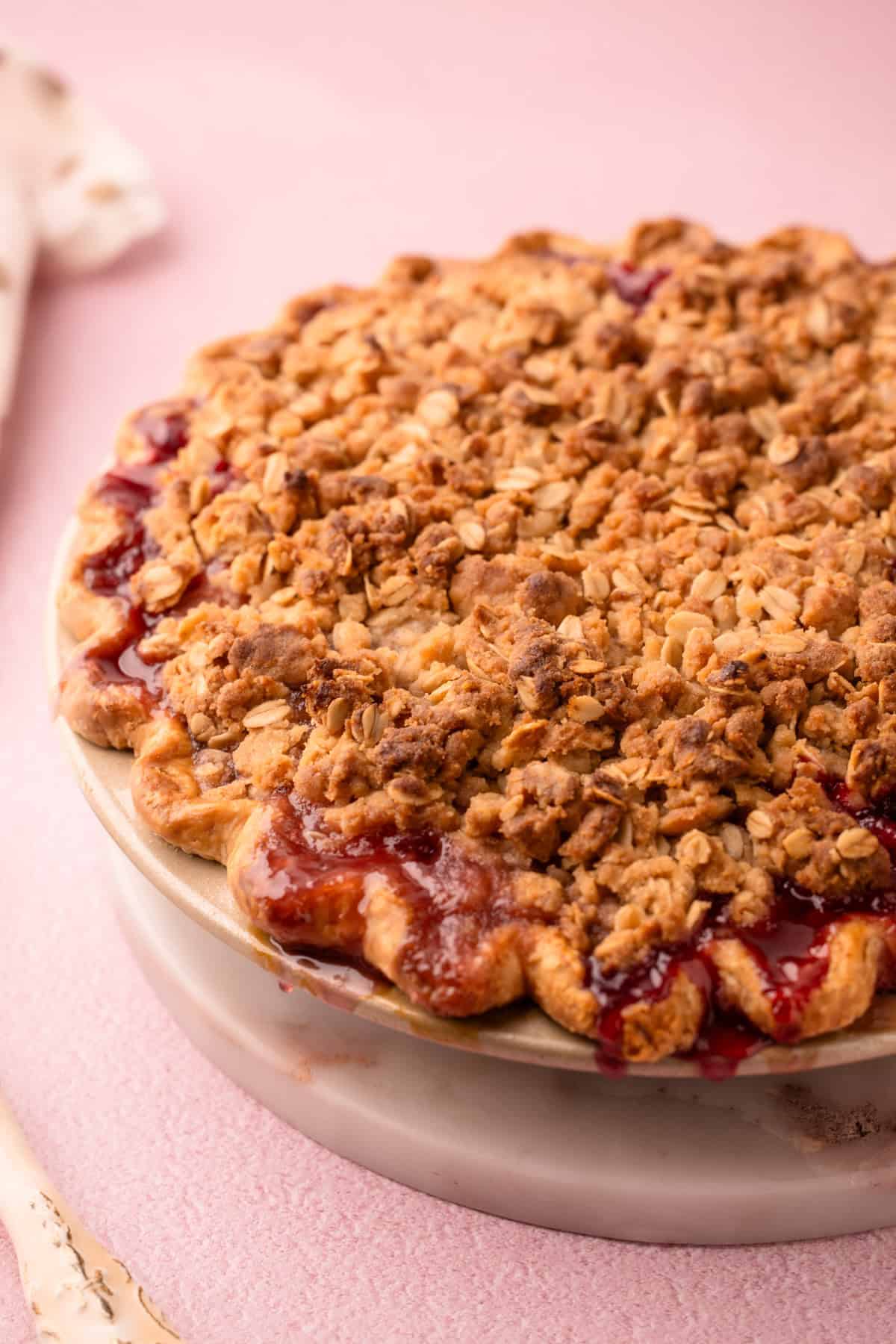 A baked, juicy nectarine plum pie with a crumble topping.