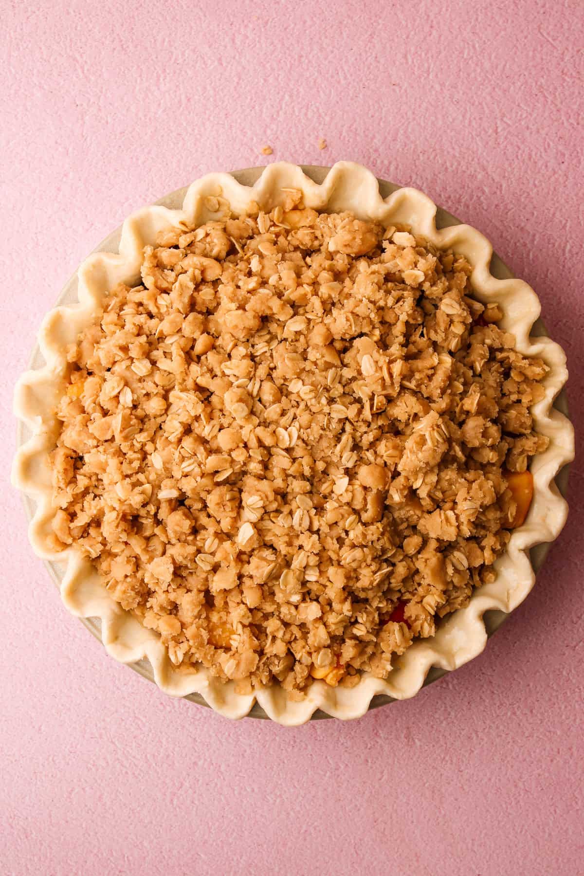 An assembled but unbaked nectarine plum pie.