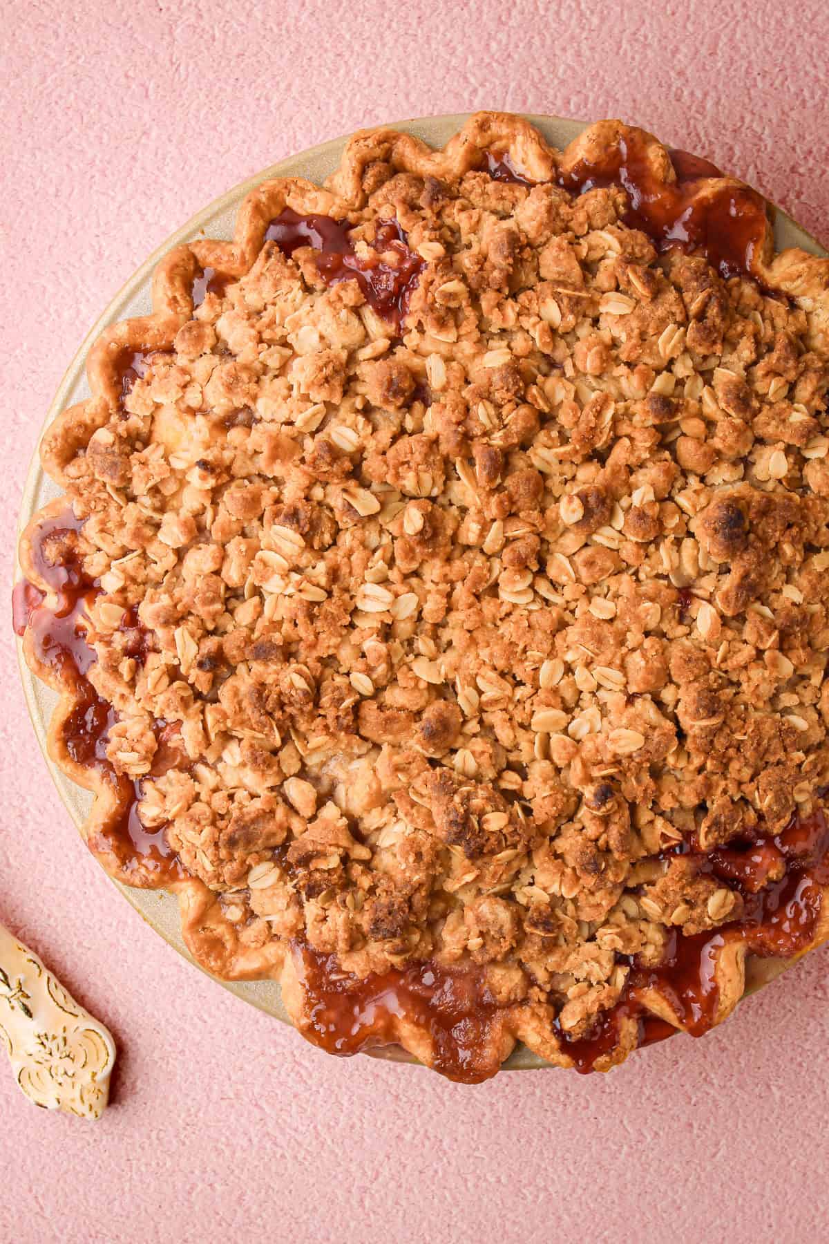 A baked, juicy nectarine plum pie with a crumble topping.