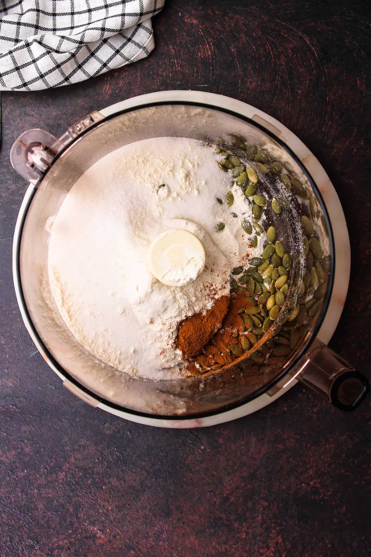 The ingredients for the pumpkin seed shortbread in a food processor.