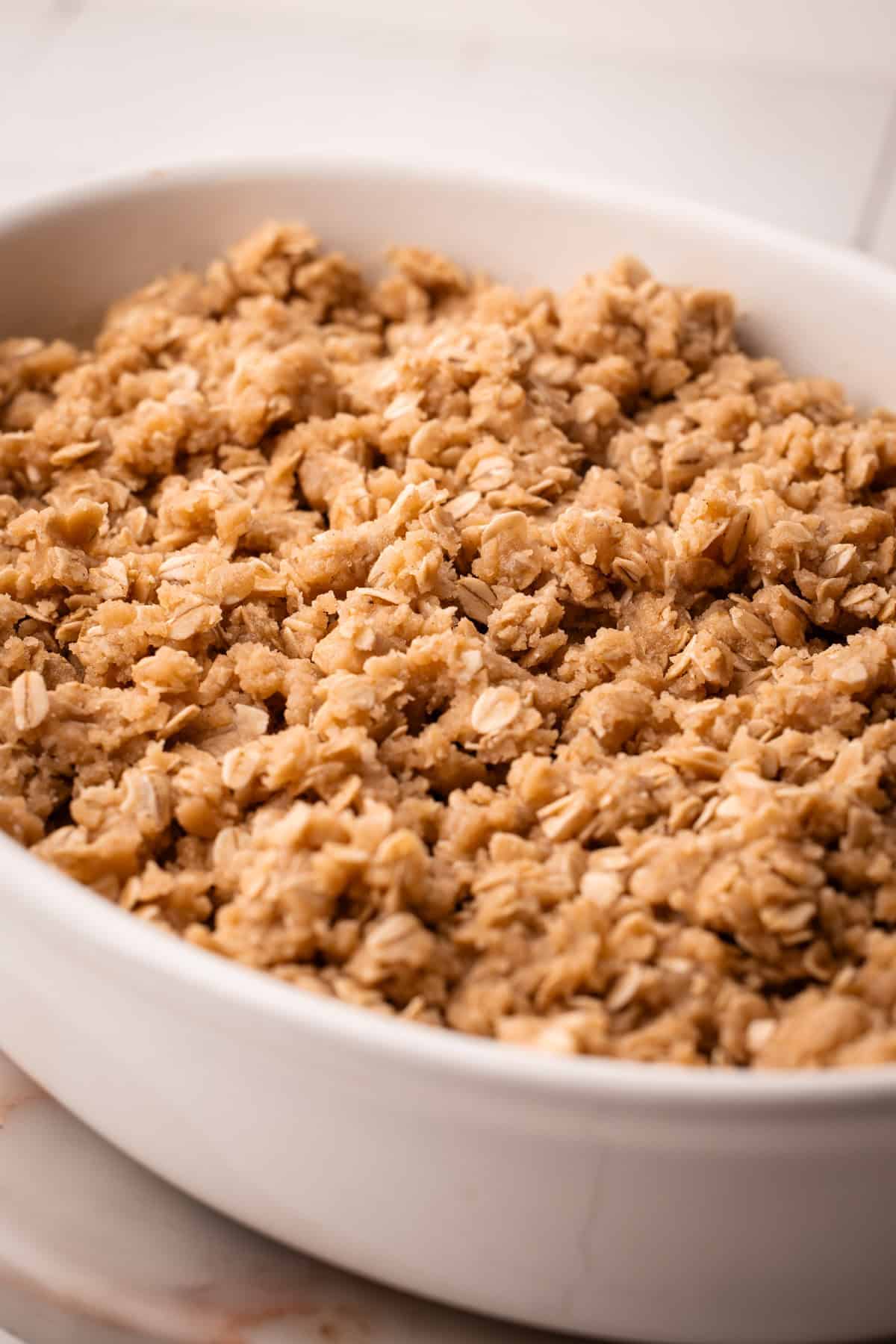Assembled but unbaked apple blueberry crisp.