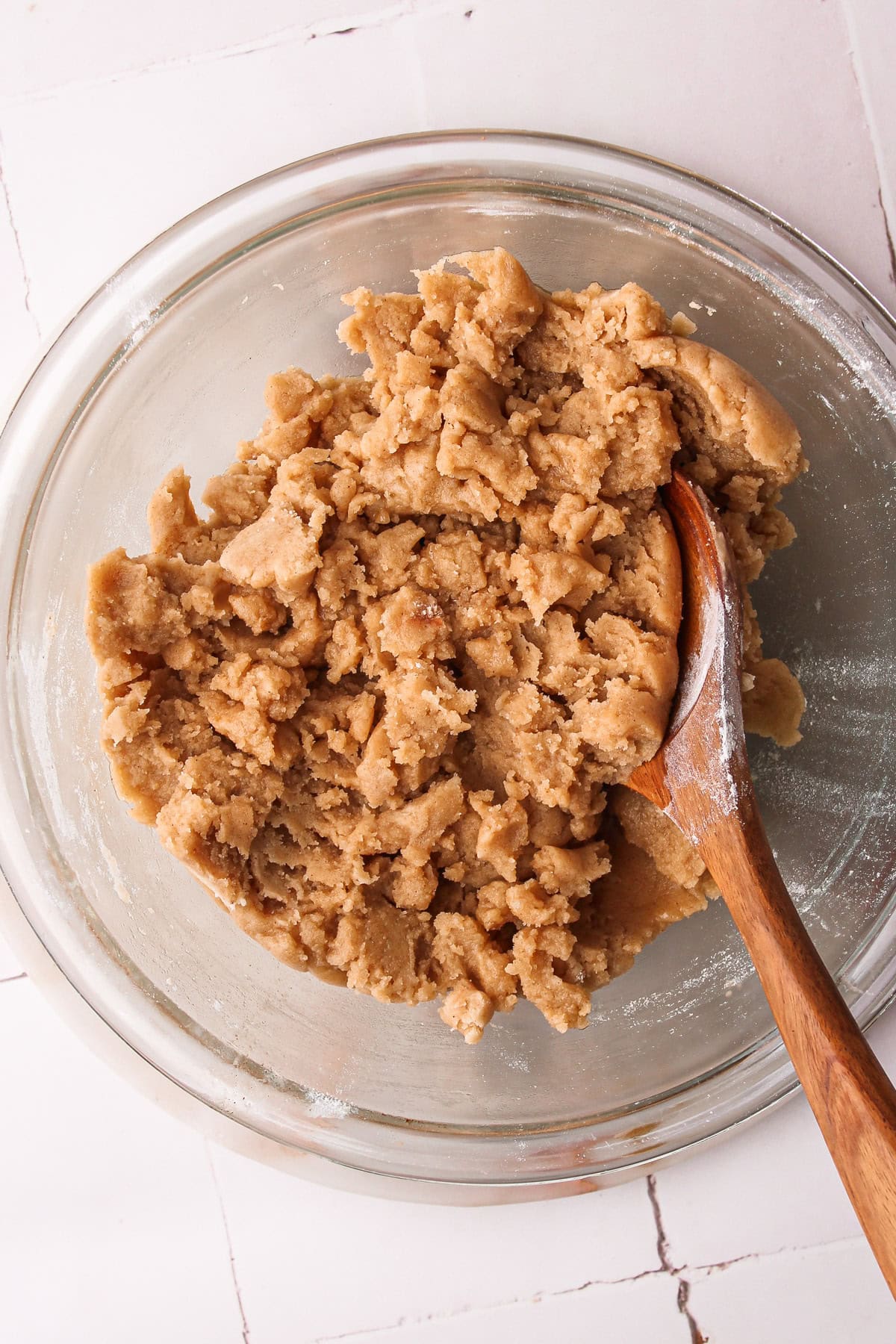 A bowl of cinnamon shortbread for apple pie bars.