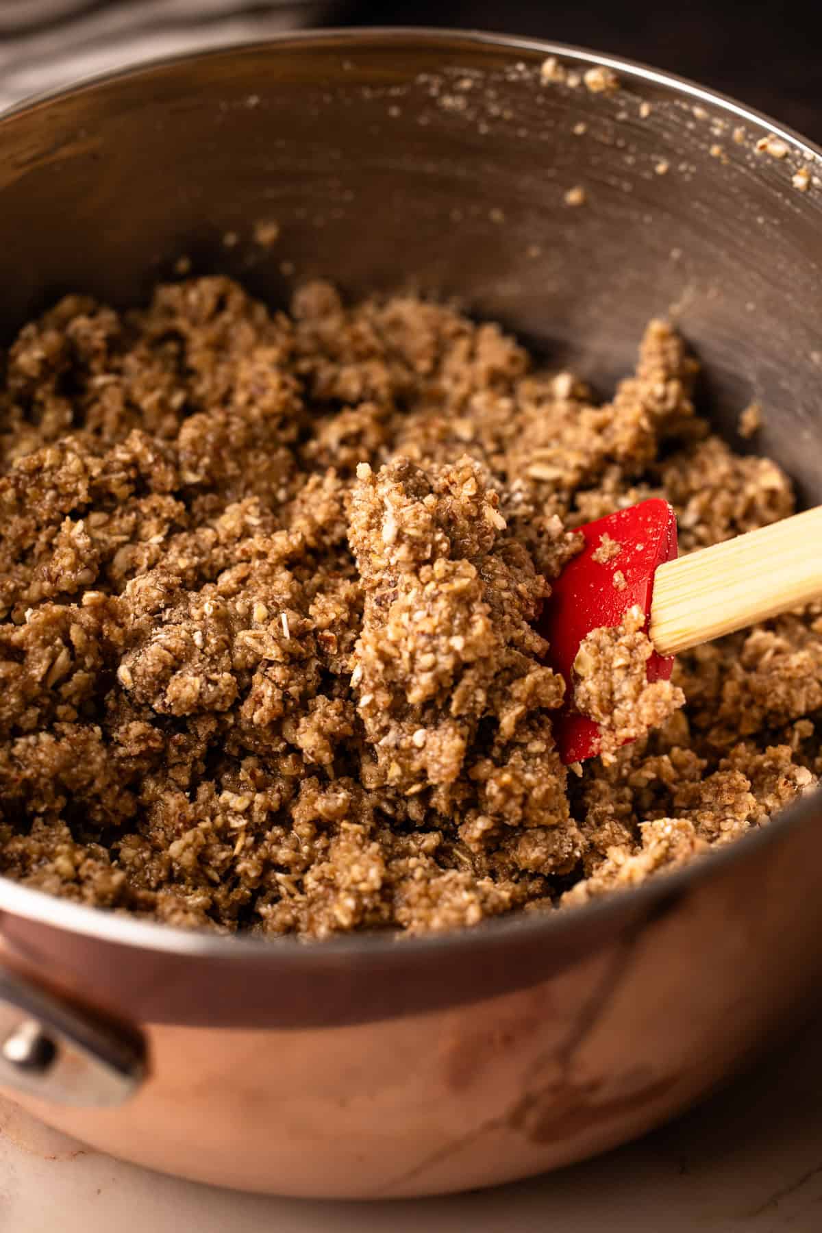 The maple oat pecan crumble topping and crust being mixed together.