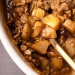 A reveal of the baked filling for an apple pear crisp recipe.