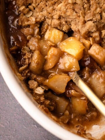 A reveal of the baked filling for an apple pear crisp recipe.