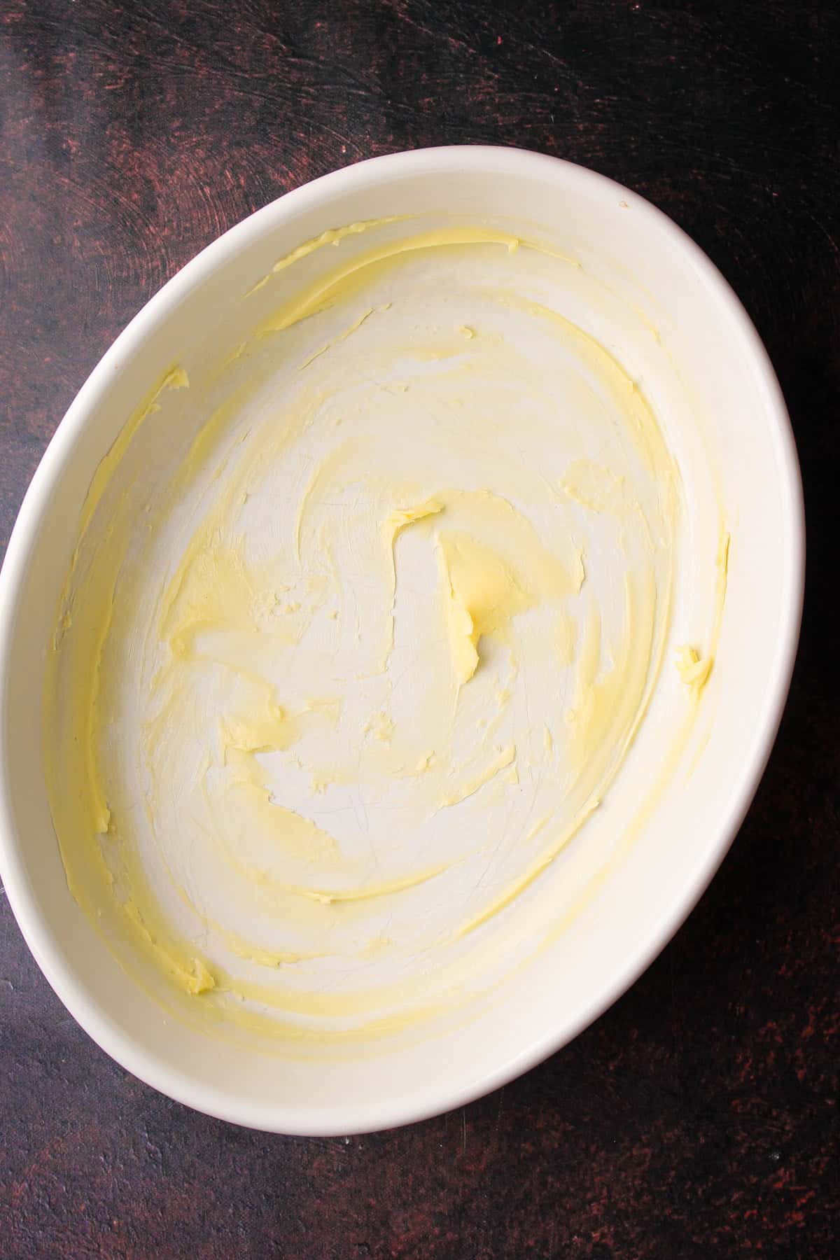 A buttered baking dish.