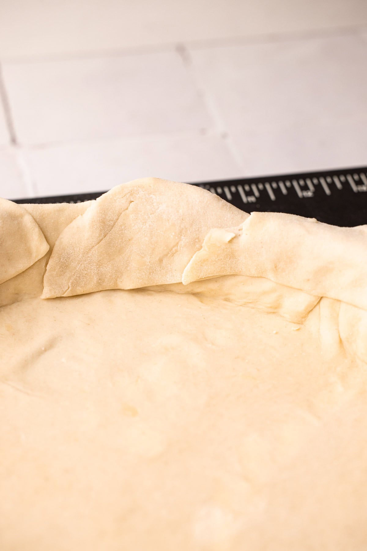 Puff pastry cut and layered together in a pie tin.