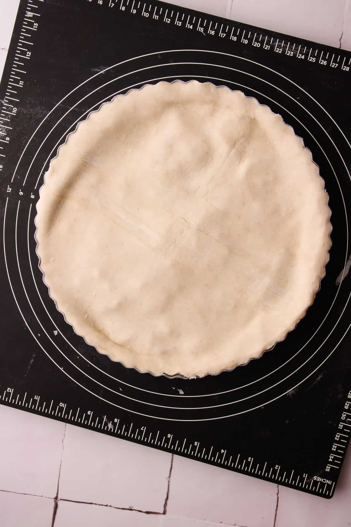 An assembled but unbaked apple pie.