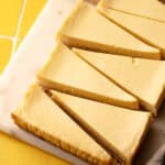 Lemon pie bars sliced into triangles