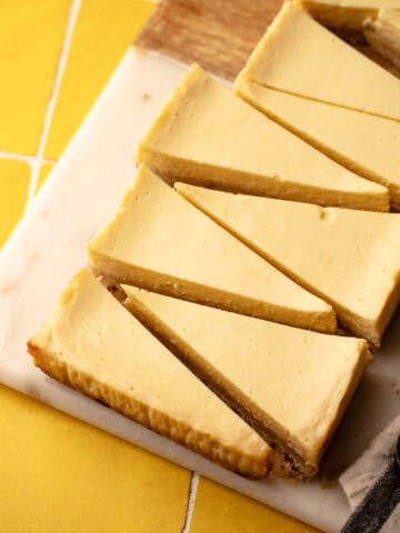 Lemon pie bars sliced into triangles
