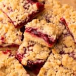 Baked and sliced and arranged cherry pie bars.