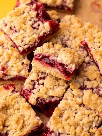 Baked and sliced and arranged cherry pie bars.