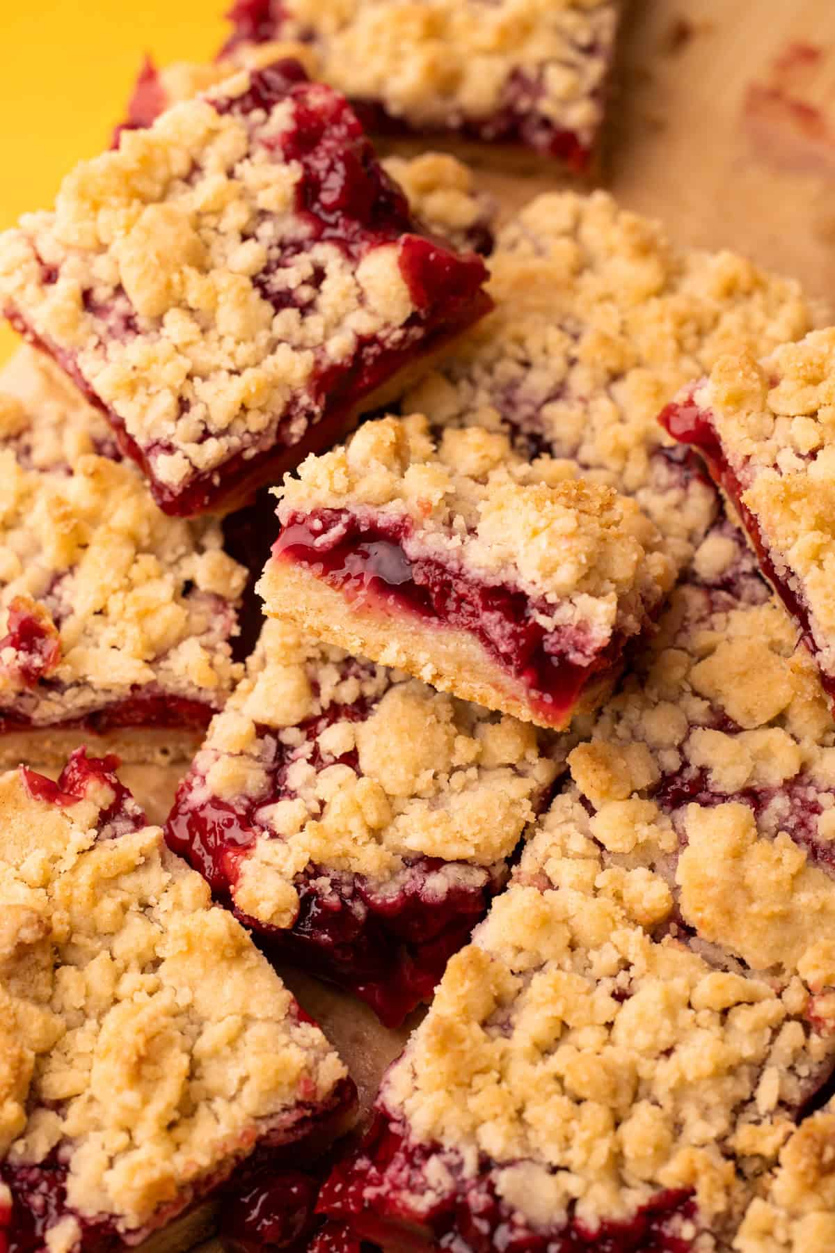 Baked and sliced and arranged cherry pie bars.