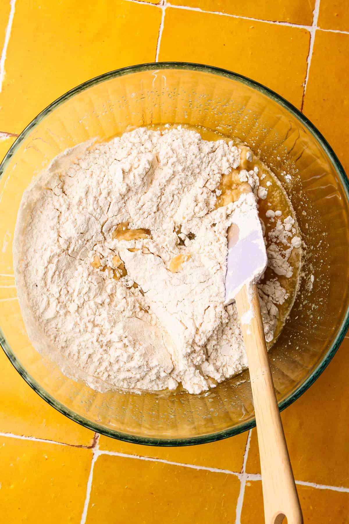 Mixing together the crust and crumb ingredients in a bowl.